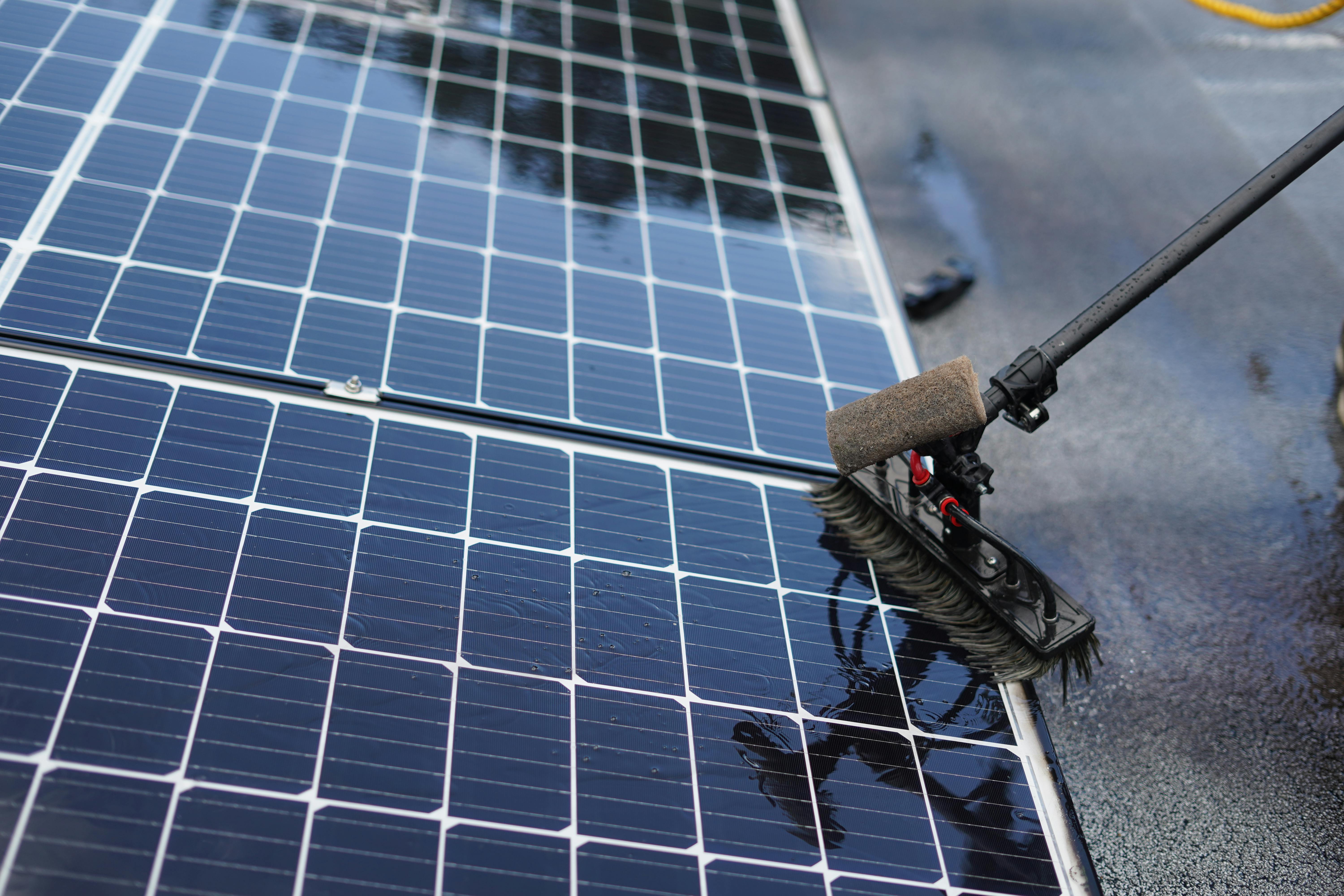 Professional solar panel cleaning and maintenance service with specialized equipment